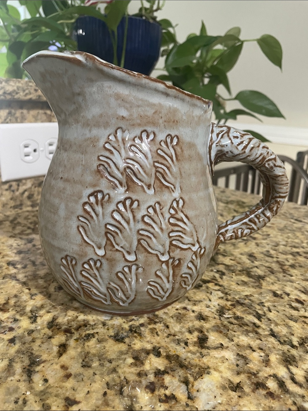 Handcrafted Ceramic Pitcher in Light Beige with Raised Botanical Texture